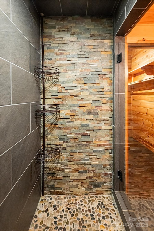 bathroom with a shower stall