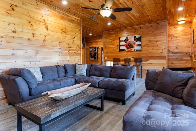 living room featuring wooden ceiling, recessed lighting, and wood finished floors