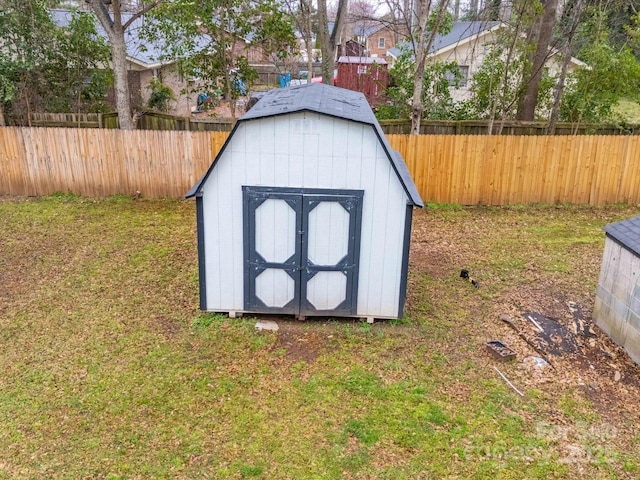 view of shed featuring fence