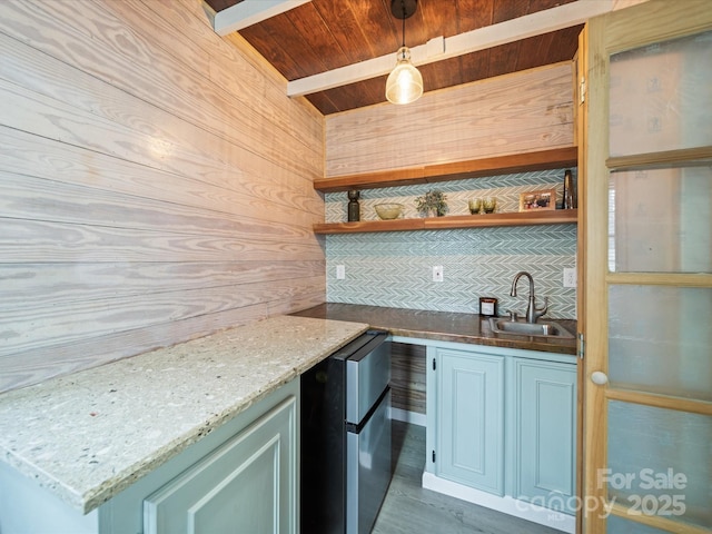 kitchen with pendant lighting, a sink, open shelves, refrigerator, and wood ceiling