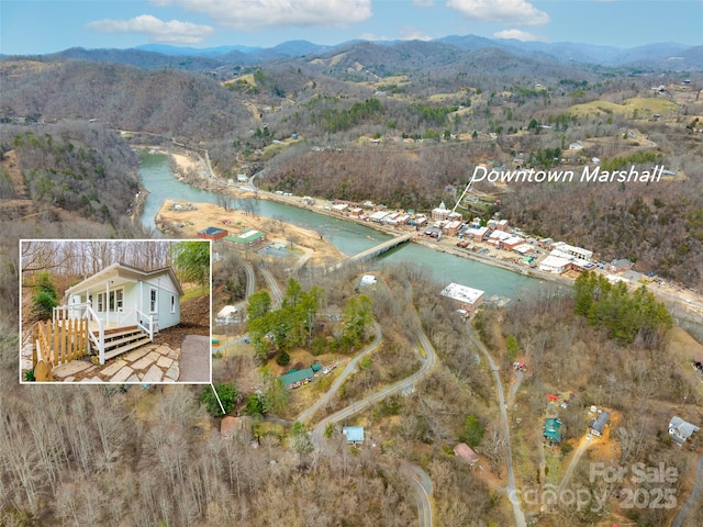 bird's eye view with a water and mountain view