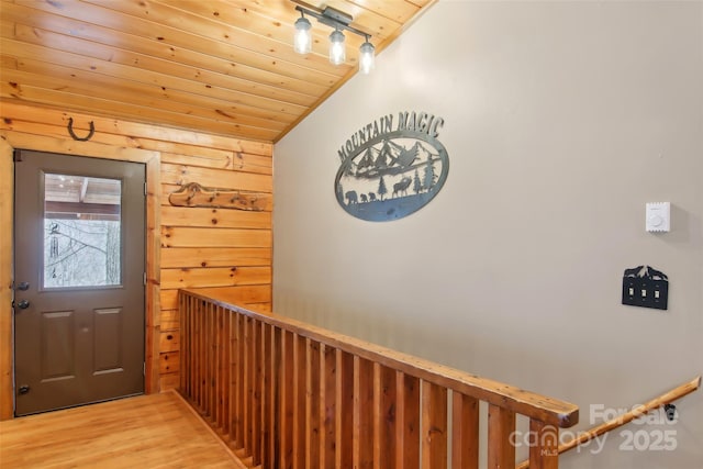 entryway featuring track lighting, wooden ceiling, vaulted ceiling, and light wood finished floors