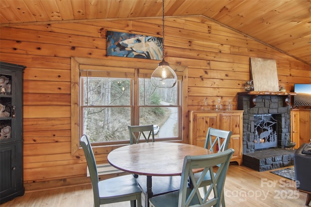 dining area featuring wood ceiling, wood finished floors, and vaulted ceiling