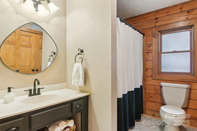 full bath featuring wooden walls, curtained shower, toilet, vanity, and a textured ceiling