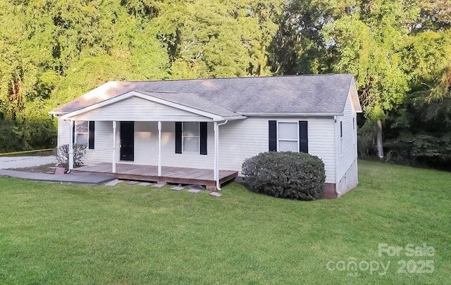 view of front of home with crawl space, a front lawn, and roof with shingles