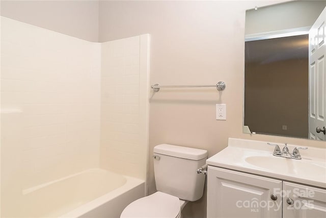 bathroom with toilet and vanity