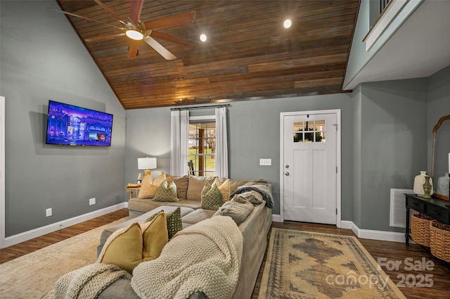 living room featuring visible vents, baseboards, and wood finished floors