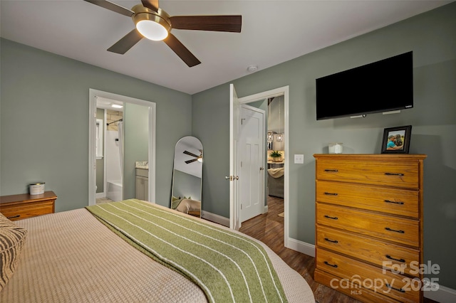 bedroom with a ceiling fan, ensuite bathroom, baseboards, and wood finished floors