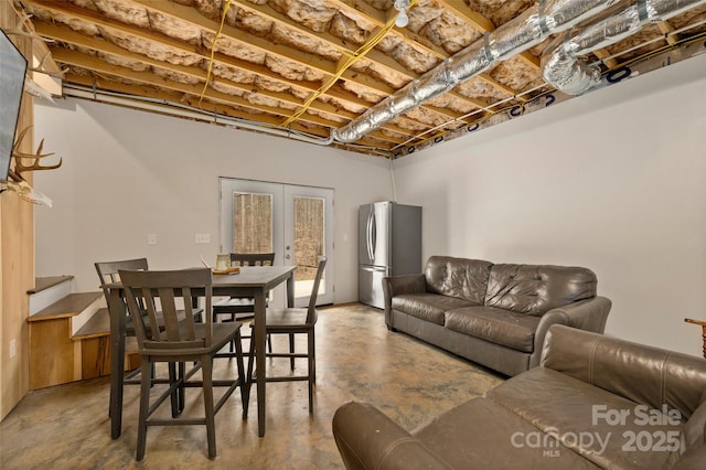 living room with french doors and finished concrete floors