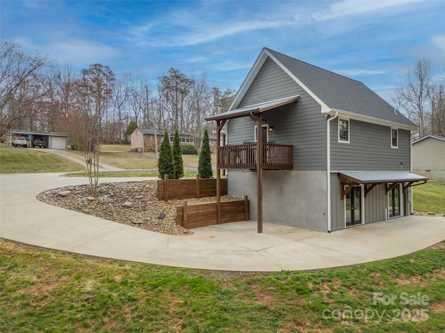 view of home's exterior with a patio area and a lawn