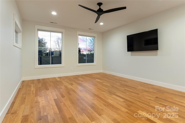 empty room featuring recessed lighting, baseboards, light wood-style floors, and ceiling fan