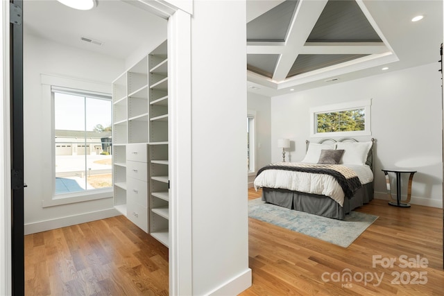 bedroom featuring visible vents, baseboards, recessed lighting, wood finished floors, and coffered ceiling