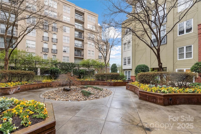 view of property's community with fence