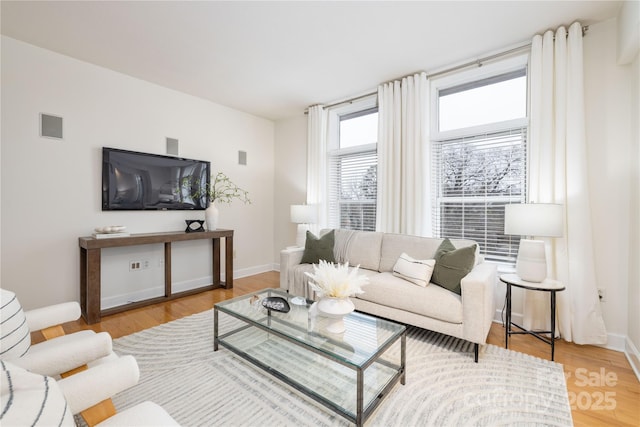 living area featuring wood finished floors and baseboards