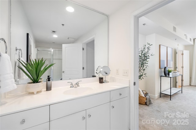 full bathroom with vanity, recessed lighting, visible vents, and a stall shower