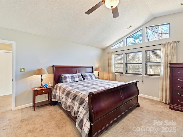 bedroom featuring visible vents, light colored carpet, multiple windows, and vaulted ceiling