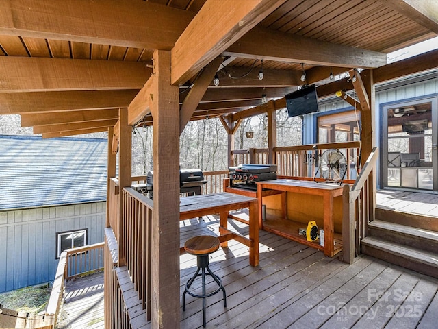 wooden terrace with area for grilling