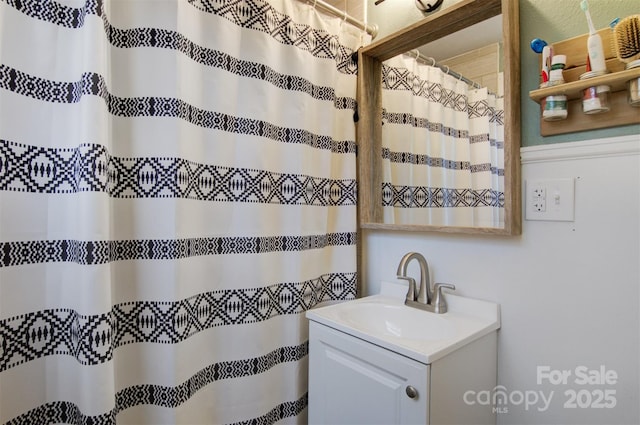 bathroom with vanity and a shower with curtain