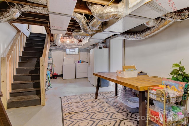 basement with washer and dryer, stairs, and freestanding refrigerator