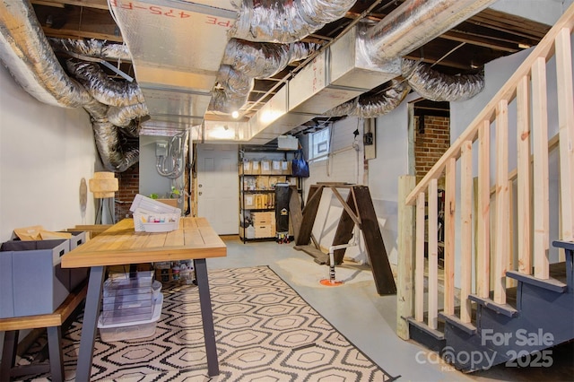 unfinished basement featuring stairs