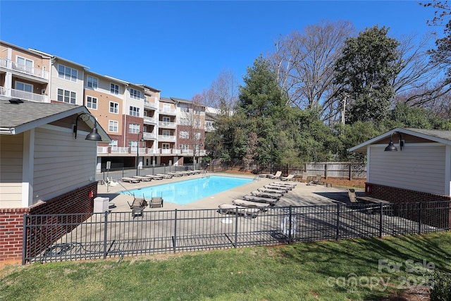 pool featuring a patio and fence