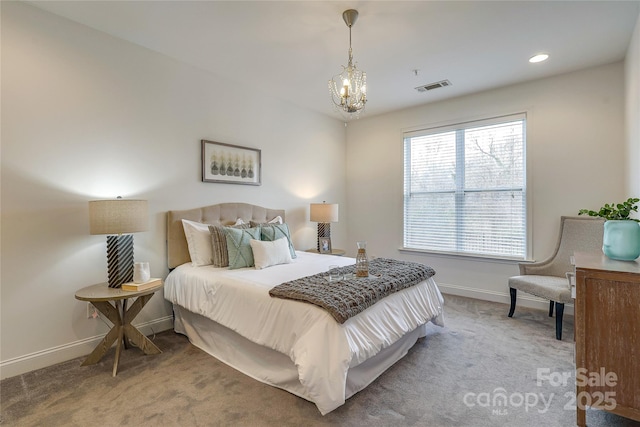 carpeted bedroom featuring recessed lighting, visible vents, baseboards, and a chandelier