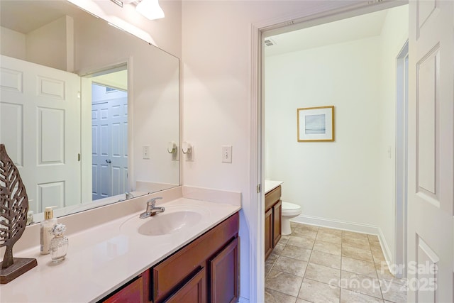 bathroom with tile patterned floors, visible vents, toilet, baseboards, and vanity