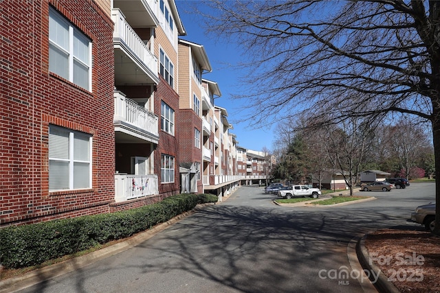 view of street with curbs and a residential view