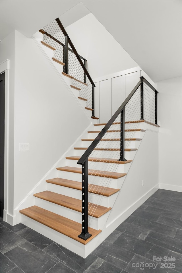 staircase with baseboards