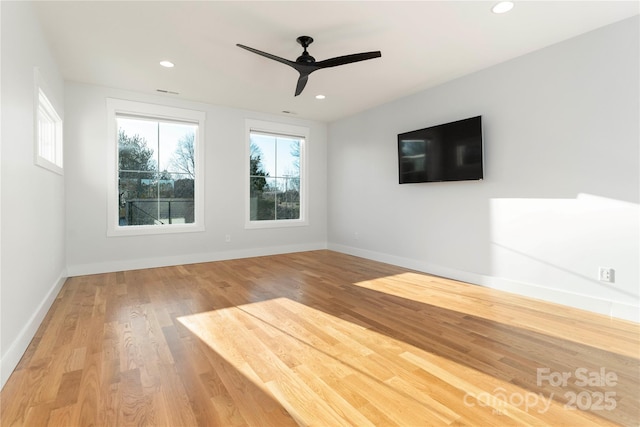 unfurnished living room with recessed lighting, wood finished floors, baseboards, and ceiling fan