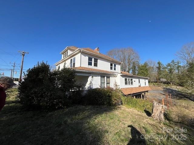 exterior space featuring a chimney