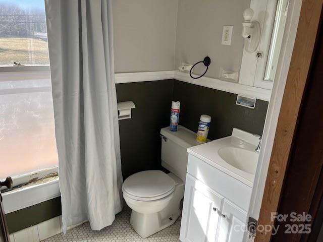 bathroom featuring vanity and toilet