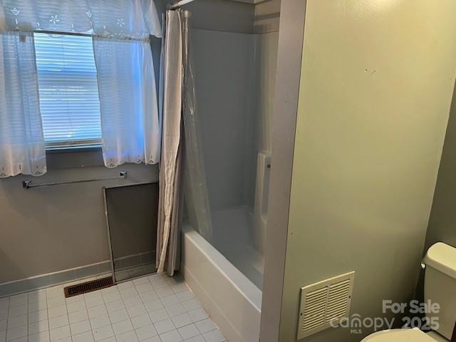 full bathroom featuring tile patterned floors, toilet, and visible vents