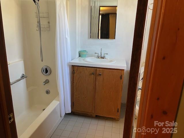 bathroom with vanity, tile patterned floors, and shower / tub combo with curtain