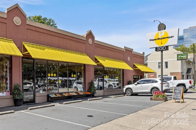 view of property with uncovered parking