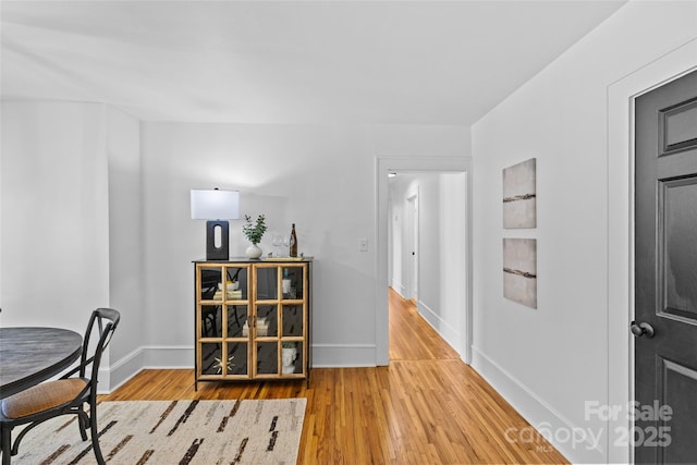 dining area featuring baseboards and wood finished floors