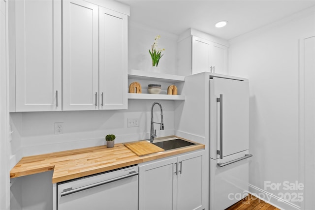 kitchen featuring wood counters, white appliances, white cabinets, and open shelves