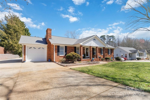 view of front of property with brick siding, a front lawn, concrete driveway, a chimney, and a garage