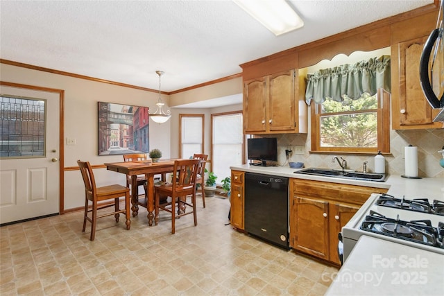 kitchen with light countertops, black dishwasher, backsplash, and a sink