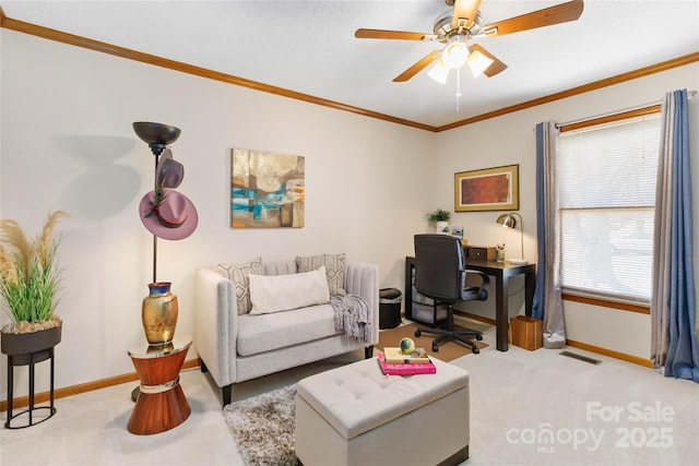 carpeted living area featuring visible vents, baseboards, a ceiling fan, and crown molding