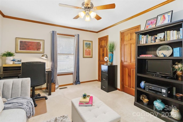 home office with a ceiling fan, baseboards, visible vents, and ornamental molding