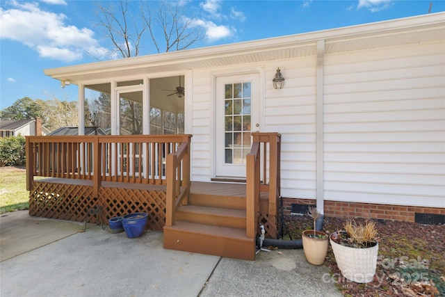 entrance to property with a wooden deck and crawl space