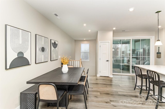 dining space featuring recessed lighting, visible vents, and light wood finished floors