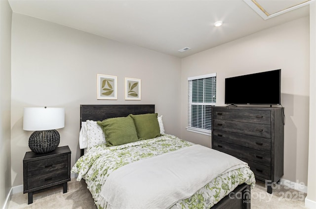 bedroom featuring light carpet and baseboards