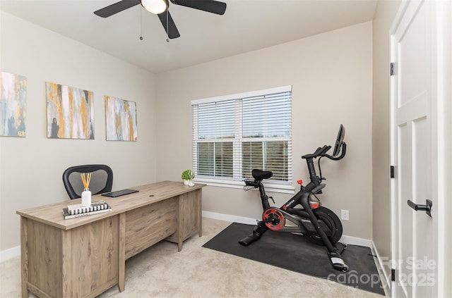 office with light colored carpet, baseboards, and ceiling fan