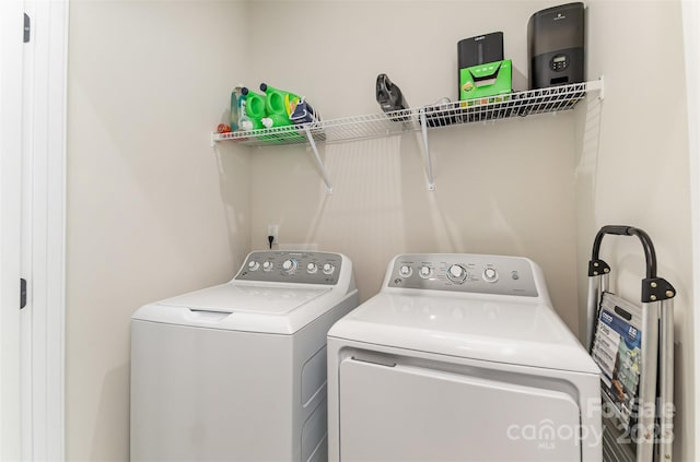 laundry area featuring laundry area and washing machine and clothes dryer