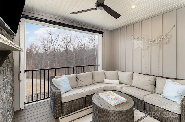 interior space featuring an outdoor living space and ceiling fan