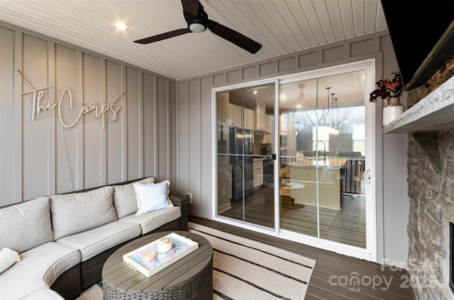 exterior space with an outdoor living space, ceiling fan, and a sink