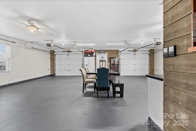garage featuring baseboards and a garage door opener