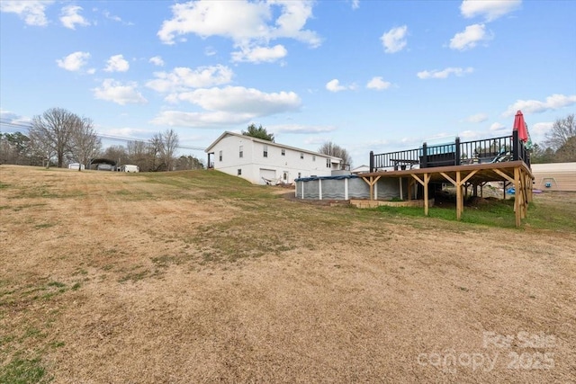 view of yard with a wooden deck